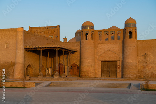 View of the ancient gates of the Alakulli Khan caravanserai on a sunny morning. Itchan-Kala, Khiva
