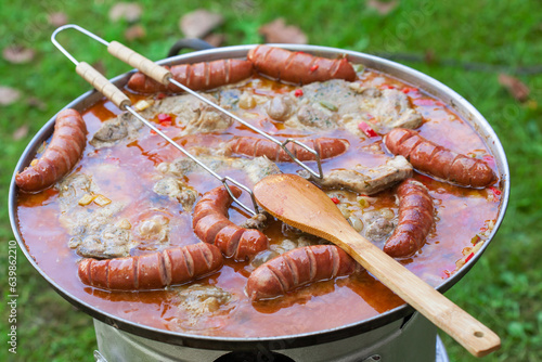 Traditional Croatian dish - kotlovina plate cooking