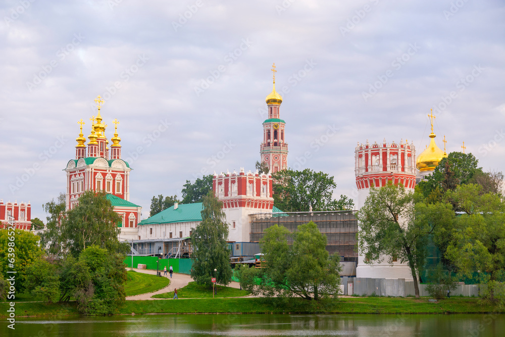 Moscow, Russia - August 12, 2022 : Novodevichy Monastery.The Cathedral in honor of the Smolensk icon of the Mother of God and the Church of the Intercession of the Most Holy Theotokos