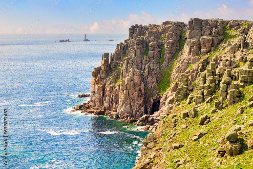The rugged Coast of Cornwall near Land's End and the Longships Lighthouse.
