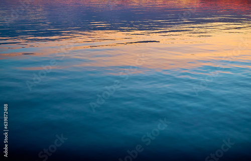 red and orange sunset rays on the water. Marine background. Pacific Northwest Coast. Sunshine Coast, British Columbia, Canada