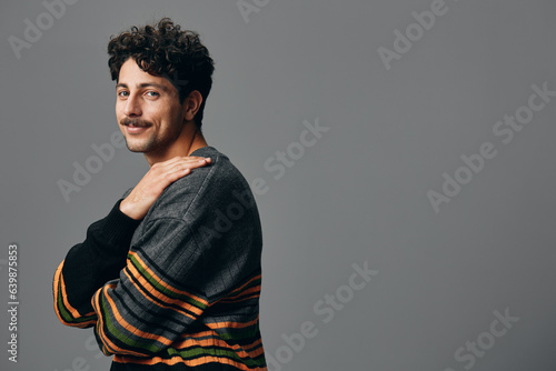 Man hipster sweater face fashion portrait copyspace trendy guy handsome studio smile
