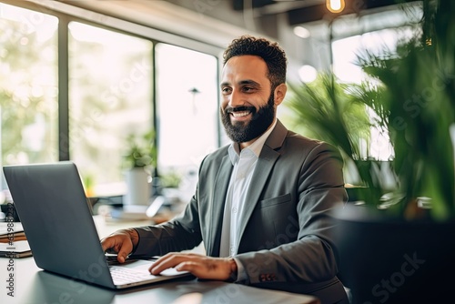 Smiling multiracial businessman reviews data at desk in bright office wearing suit. Photo generative AI © pixardi