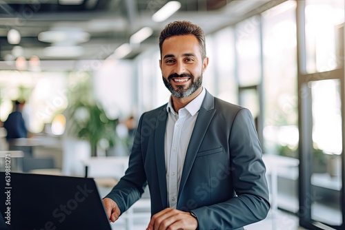 Smiling multiracial businessman reviews data at desk in bright office wearing suit. Photo generative AI