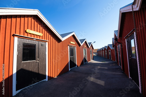 Wooden boat, fisherman huts in row in Donsö, Gothenburg archipelago, Sweden on a sunny day