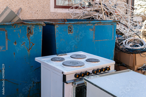 A lot of different garbage, construction debris, waste in big containers