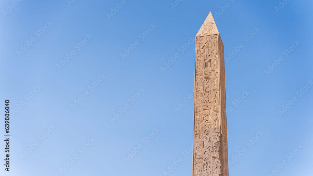 Obelisk of Thutmose I set against a blue sky