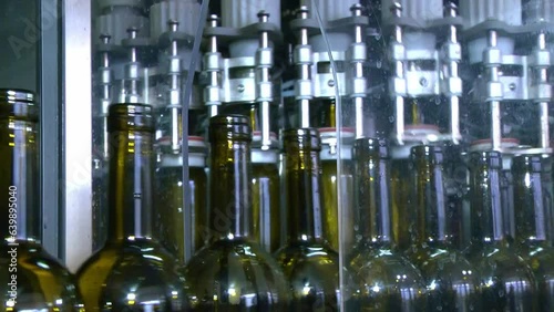 Industrial wine bottling plant machine. Modern industry production line for wine	