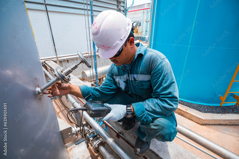 Male workers are for inspection of ultrasonic thickness nozzles pipe of stainless steel Male workers are for inspection of ultrasonic thickness nozzles pipe of stainless steel