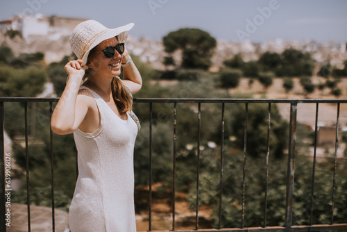 A young woman in a white dr...