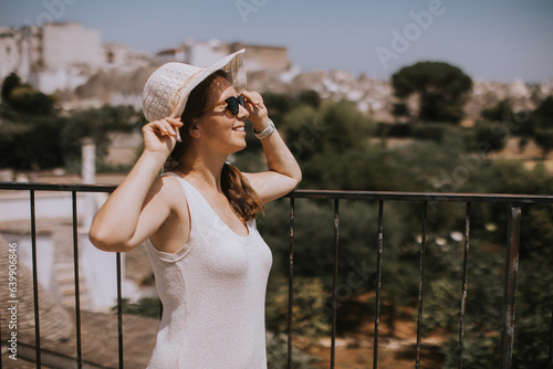 A young woman in a white dr...