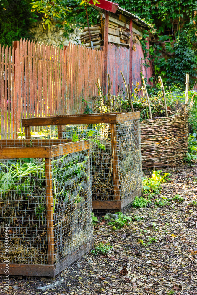Composting of organic waste. Three containers for organics. Homemade