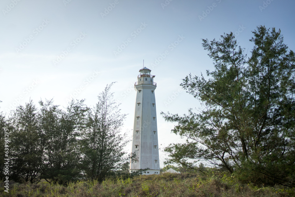 Lighthouse View between Palms at Glagah Beach, Kulon Progo, Daerah Istimewa Yogyakarta Lighthouse View between Palms at Glagah Beach, Kulon Progo, Daerah Istimewa Yogyakarta