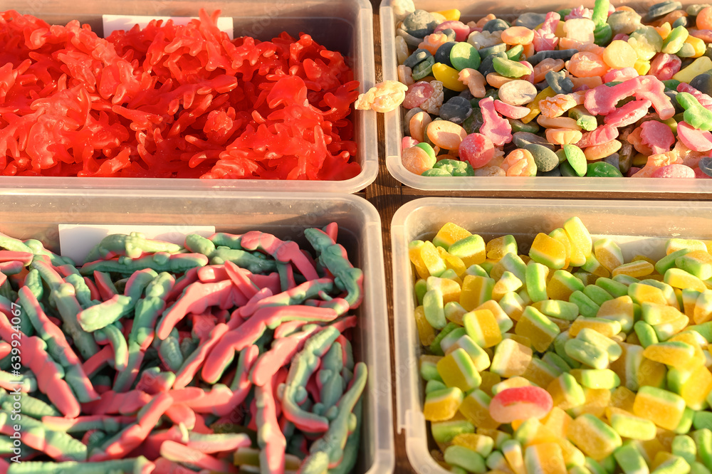 Sweet chewy candies of different colors on sale on the street.