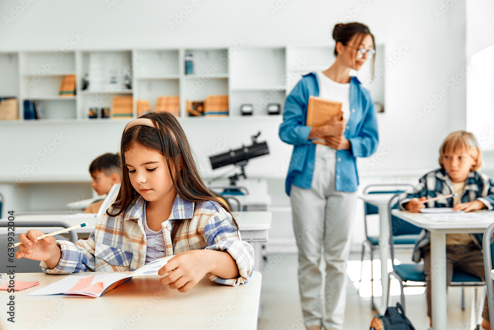 Fototapeta premium Children learning in a school classroom