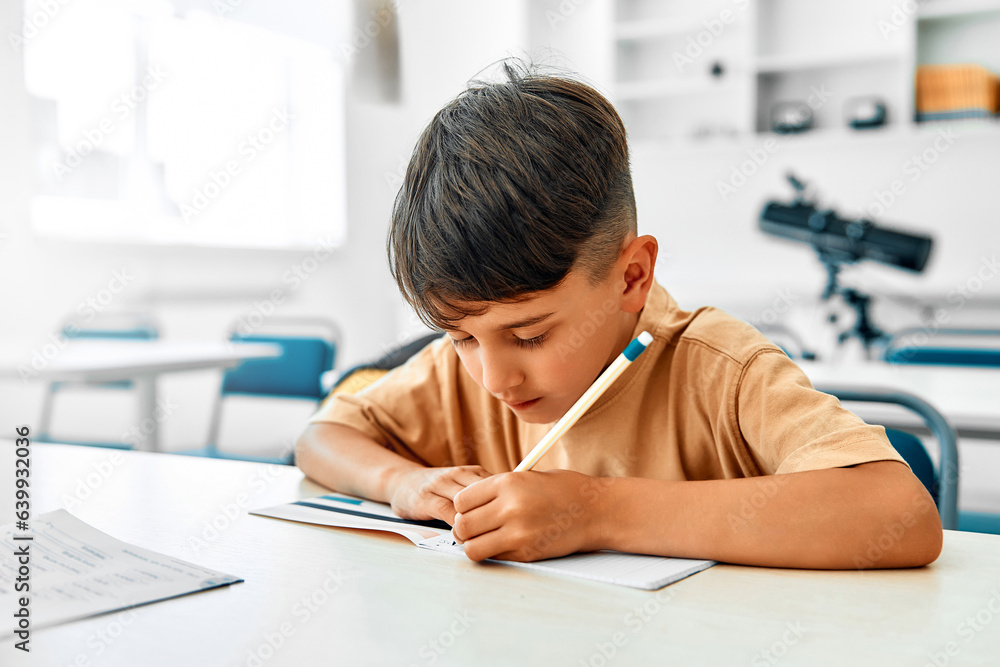 Children learning in a school classroom Children learning in a school classroom