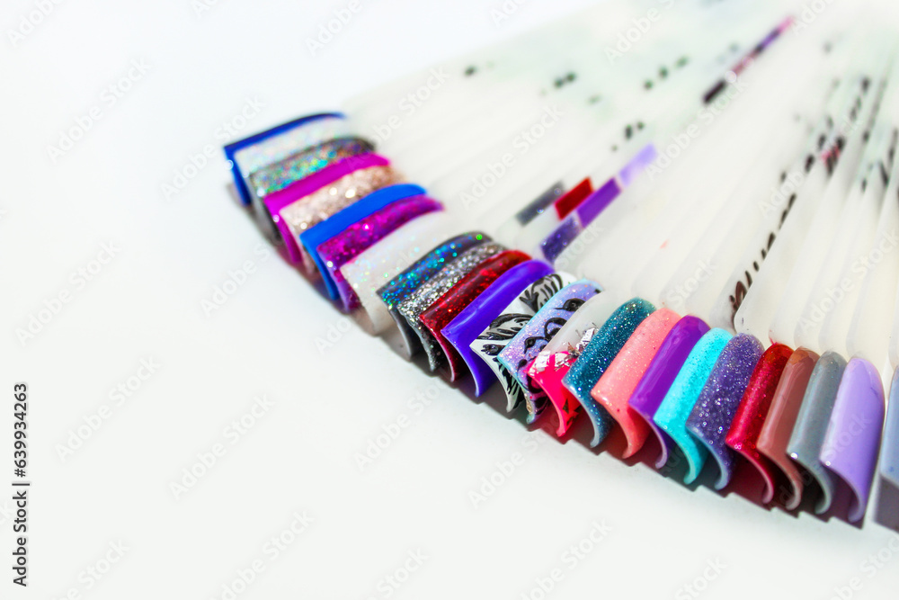 Palette of nail designs, testers of multicolored polishes on flat nails Palette of nail designs, testers of multicolored polishes on flat nails