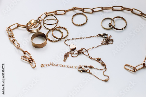 Quadro su tela Blackened from the water, damaged poor-quality jewelry on a white background
