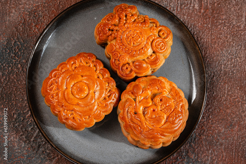 A mooncake  is a Chinese bakery product traditionally eaten during the Mid-Autumn Festival.