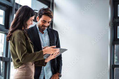 Male mature caucasian ceo businessman leader with diverse coworkers team executive managers group meeting. Multicultural professional businesspeople working together on research plan boardroom.