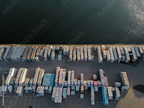 Aerial view of bricks on pallets on the quauside at Tilbury Docks on the Lower River Thames,  near London, UK.
