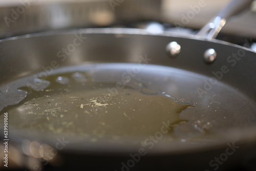 Pan with oil boiling close up
