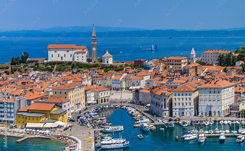 An aerial view towards the inner harbour and old quarter in the town of Piran, Slovenia in summertime