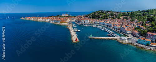 A panorama aerial view across the harbour and old town of Piran, Slovenia in summertime