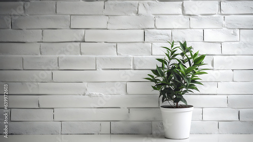 wall with white bricks with a green plan on the side. Empty space for text or product placement