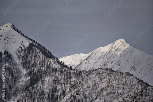 Russia. North-Eastern Caucasus. The inaccessible slopes of the eternally snow-covered high-altitude peaks of the Caucasus in the eastern regions of Dagestan. photo