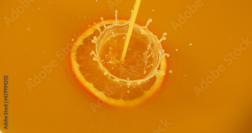 Orange, citrus sinensis, Fruit falling into Orange Juice