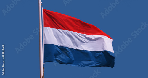 Luxembourgish Flag Waving in the Wind against blue sky Free Download Luxembourgish Flag Waving in the Wind against blue sky - GFXLoad