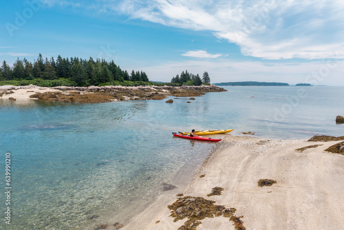 kayaks beached on an island in Stonington, Maine photo