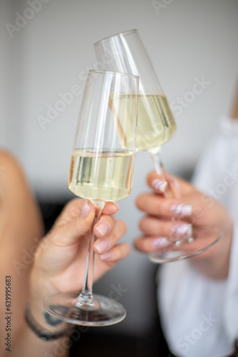 person holding a glass of champagne