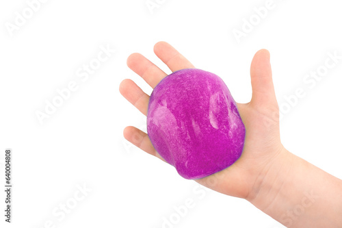 A child's hand holds a toy with purple slime on a transparent background. View from above.