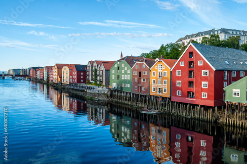 Fjord embankment with colorful wooden houses in Trondheim city, Norway.