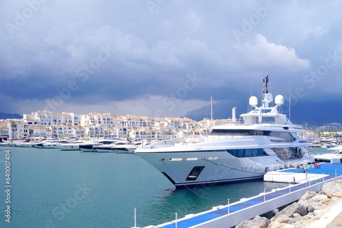 dark clouds over luxury yachts in Puerto Banús marina near Marbella, Málaga, Andalusia, Spain photo