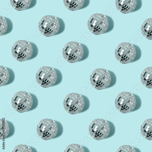 Disco ball pattern on blue pastel background. Minimal party concept. Flat lay.