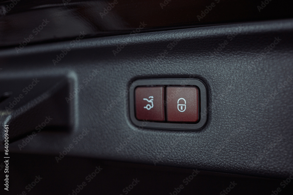 Closeup of the trunk release button. modern car interior