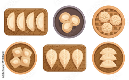 Set Of Different Dumplings On Wooden Plated And Boards. Steamed, Fried, Or Boiled Delectable Pockets Of Dough