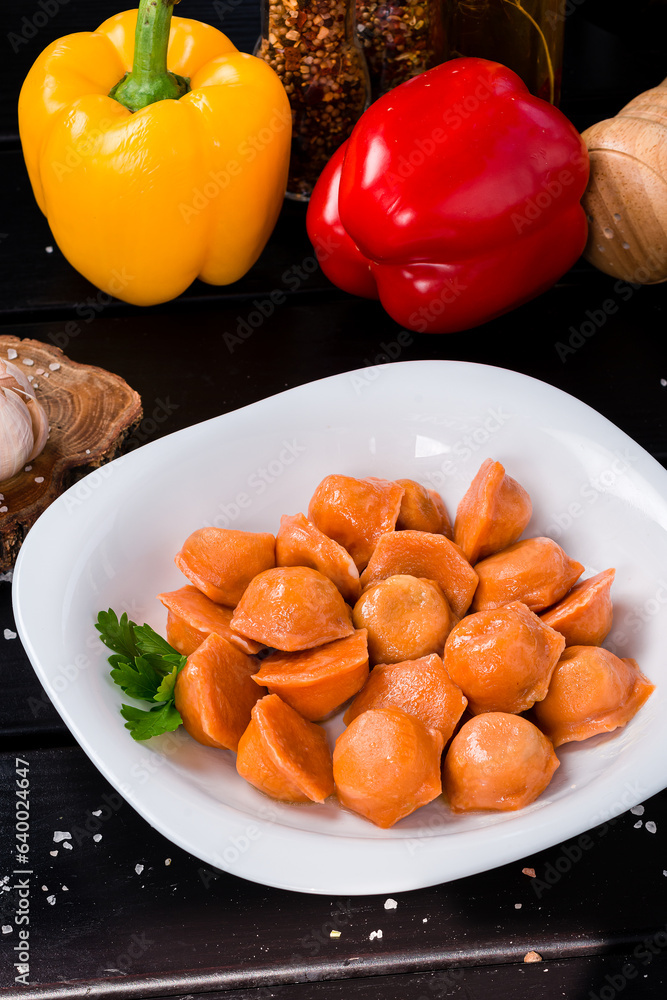 Boiled carrot dumplings with meat with sweet pepper, herbs and spices. Boiled carrot dumplings with meat with sweet pepper, herbs and spices.