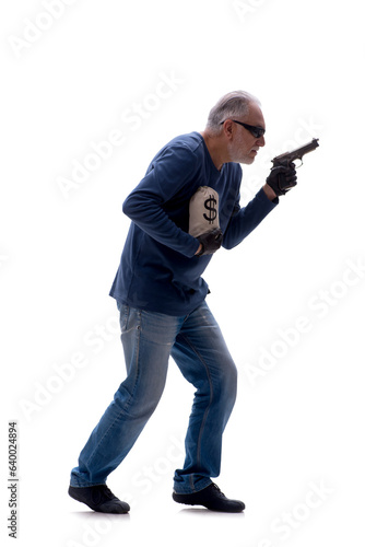 Old male burglar holding moneybag isolated on white