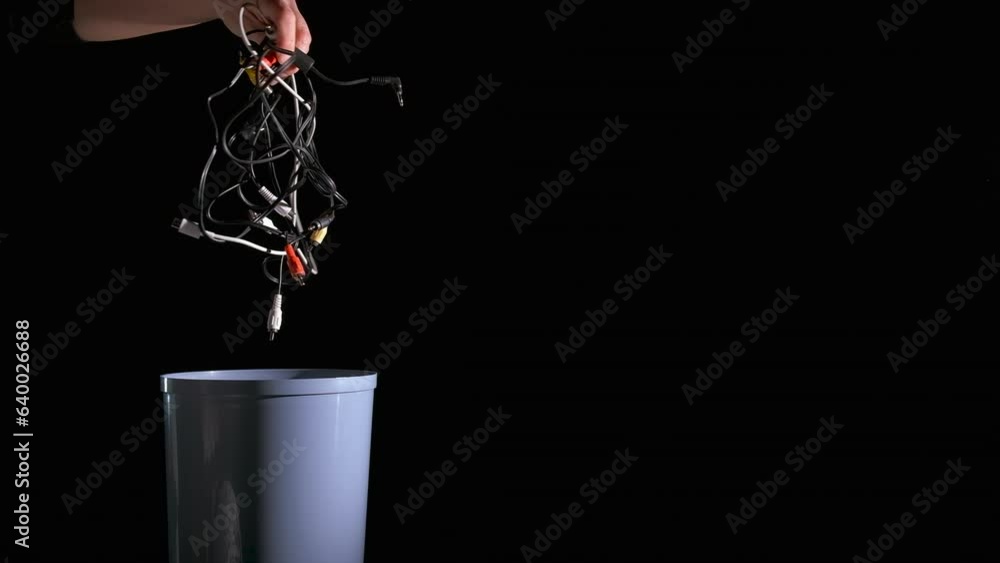 Eco pollution from plastic device. A woman hand throw the wires into