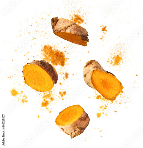 Fresh turmeric root falling in the air isolated