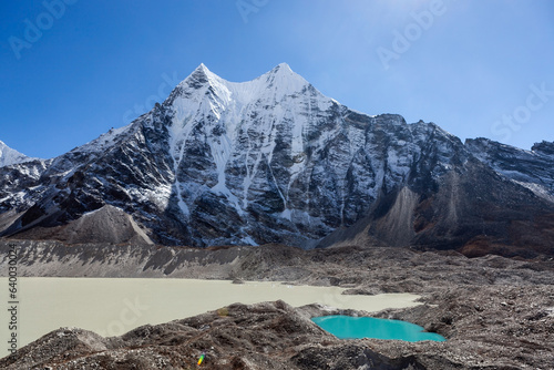 Snowy mountain peak and moraine lakes near Island Peak base camp andAmphu Laptsa pass in Himalayas, Nepal. photo