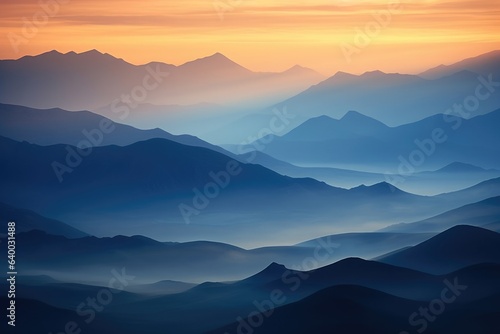A high view sunrise or sunset over a mountain range low lying fog with mountain in silhouette, Stunning Scenic World Landscape Wallpaper Background