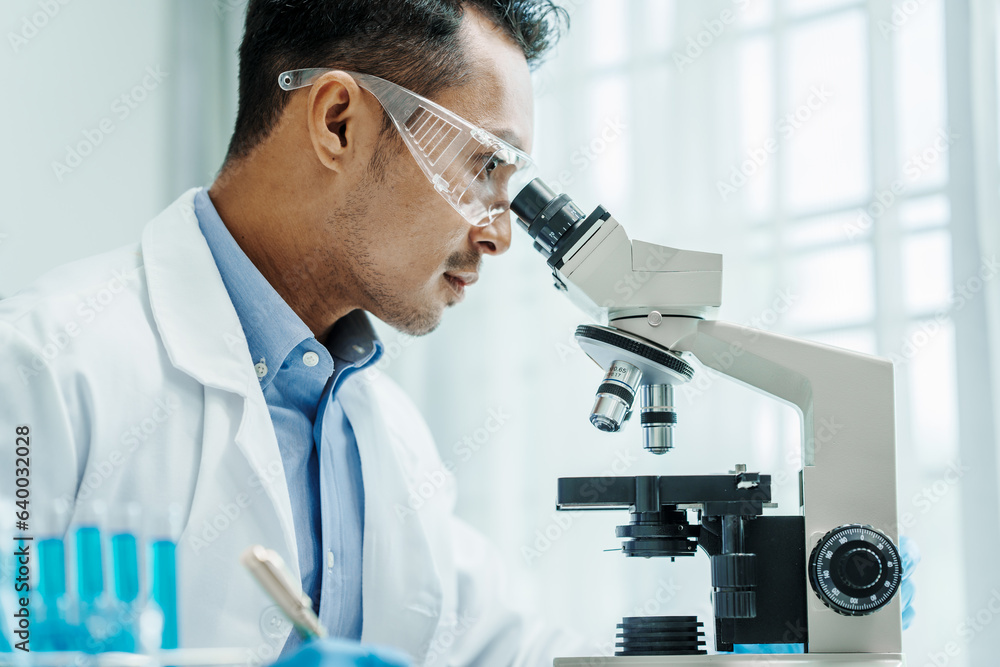 Asian male scientists white coat conducting research investigations medical laboratory, lab bacteria, microbiology laboratory public health, animal health, Aerobes, anaerobes, mycobacteria and fungi Asian male scientists white coat conducting research investigations medical laboratory, lab bacteria, microbiology laboratory public health, animal health, Aerobes, anaerobes, mycobacteria and fungi