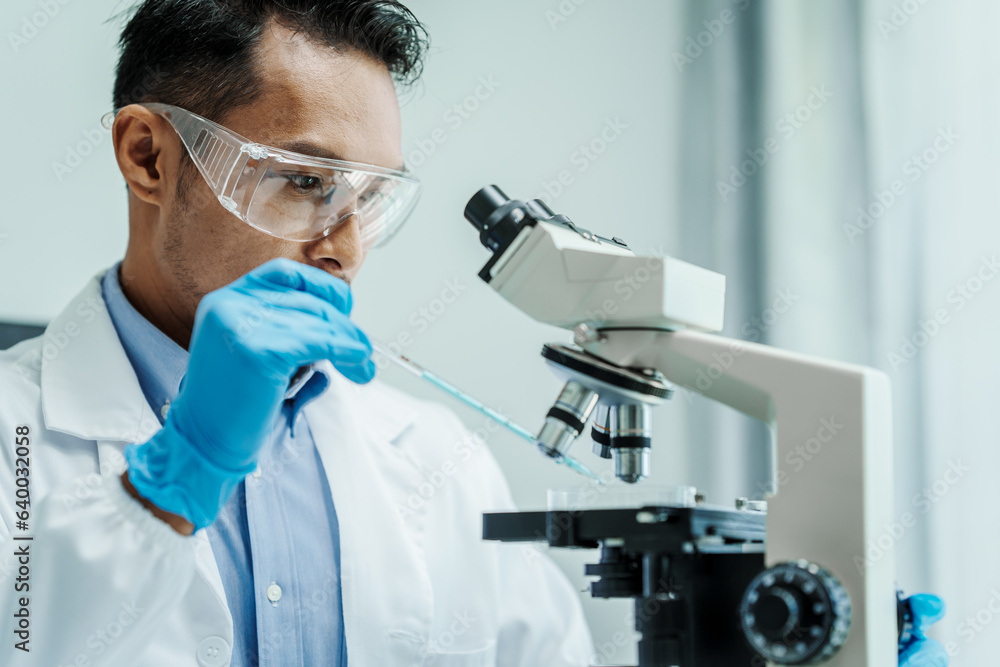 Asian male scientists white coat conducting research investigations medical laboratory, lab bacteria, microbiology laboratory public health, animal health, Aerobes, anaerobes, mycobacteria and fungi Asian male scientists white coat conducting research investigations medical laboratory, lab bacteria, microbiology laboratory public health, animal health, Aerobes, anaerobes, mycobacteria and fungi
