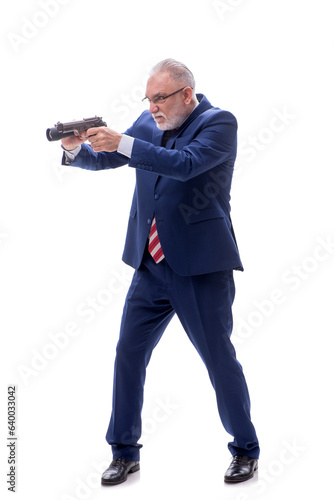 Old policeman with gun isolated on white