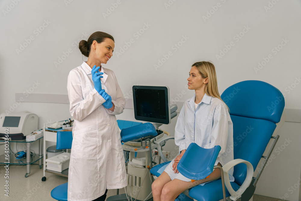 Fototapeta premium Woman on appointment with her gynecologist during visit to women's consultation. High quality photo